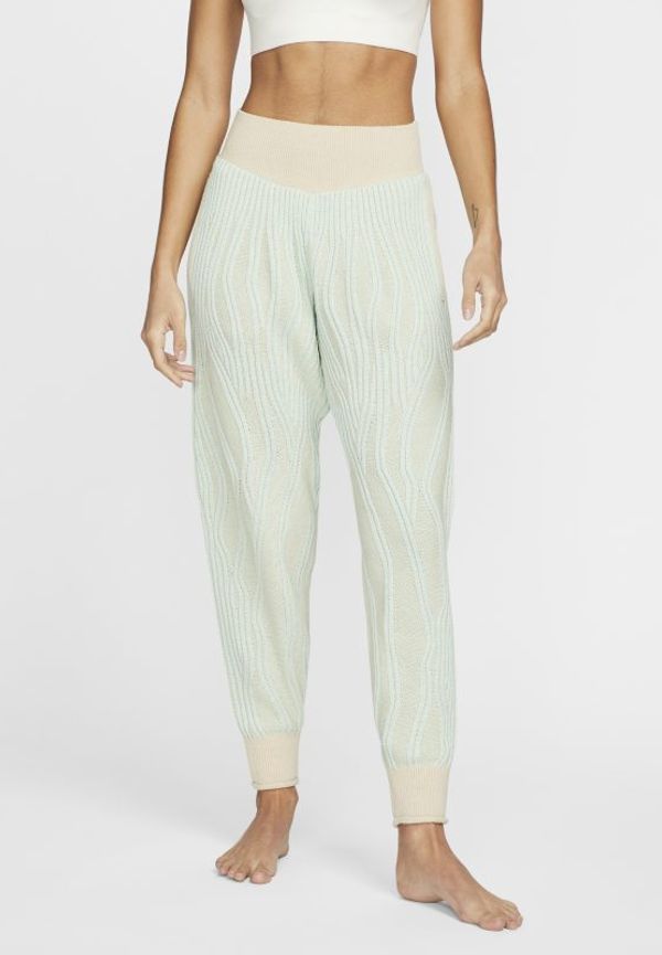Joggingbyxor Nike Yoga för kvinnor - Brun