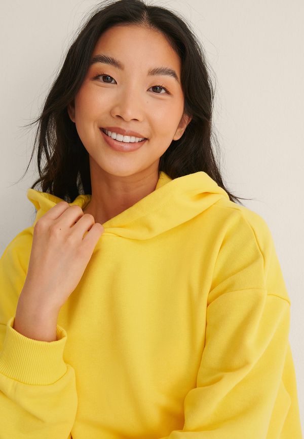 NA-KD Trend Ekologisk oversize hoodie med ficka - Yellow