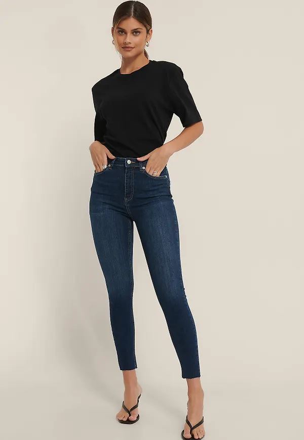 NA-KD Reborn Ekologiska skinny jeans med hög midja och rå fåll - Blue