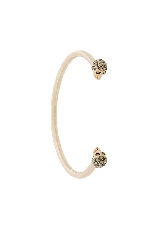 Alexander McQueen twin skull bracelet - Guldfärgad