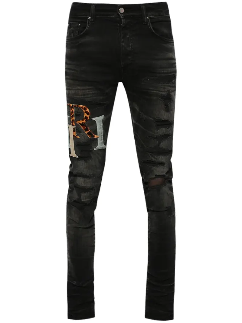 AMIRI slitna skinny-jeans med logotypmärke - Svart