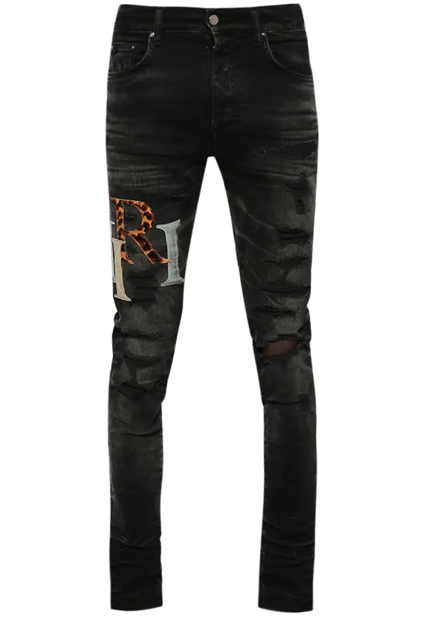 AMIRI slitna skinny-jeans med logotypmärke - Svart