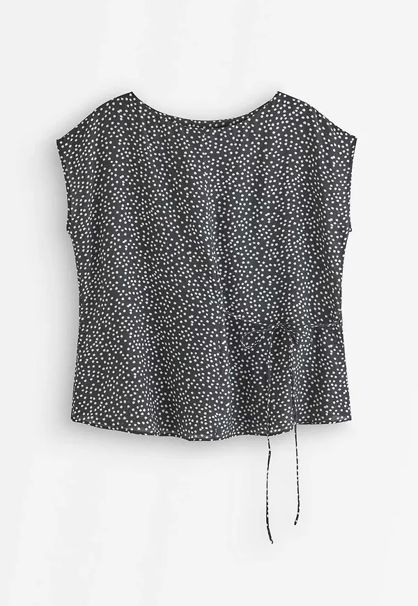 Ärmlös blus med knytband