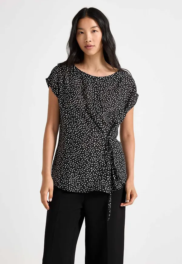 Ärmlös blus med knytband