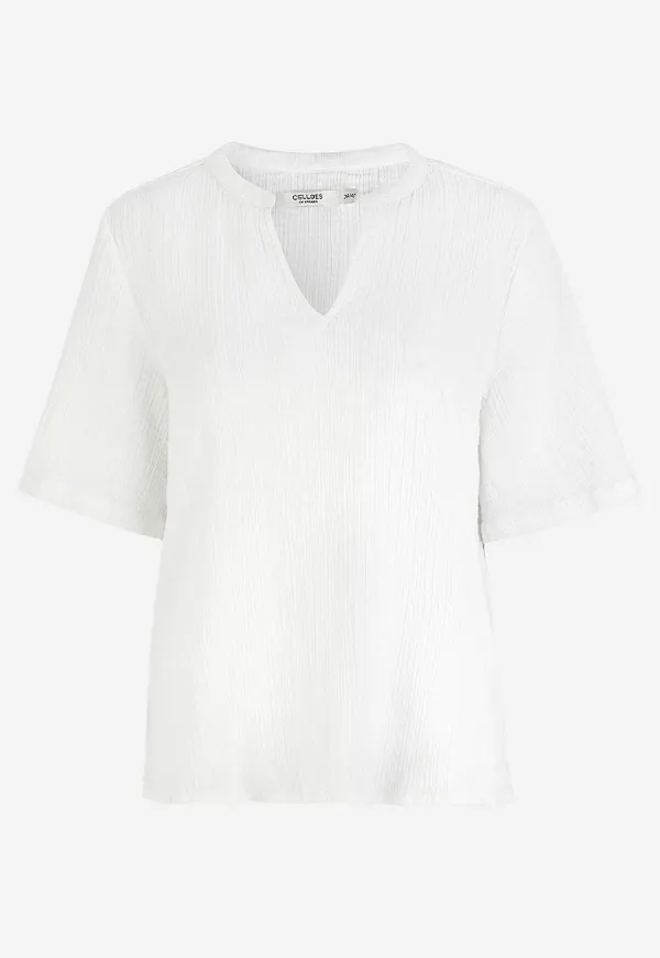 Blus i krinklad bomull