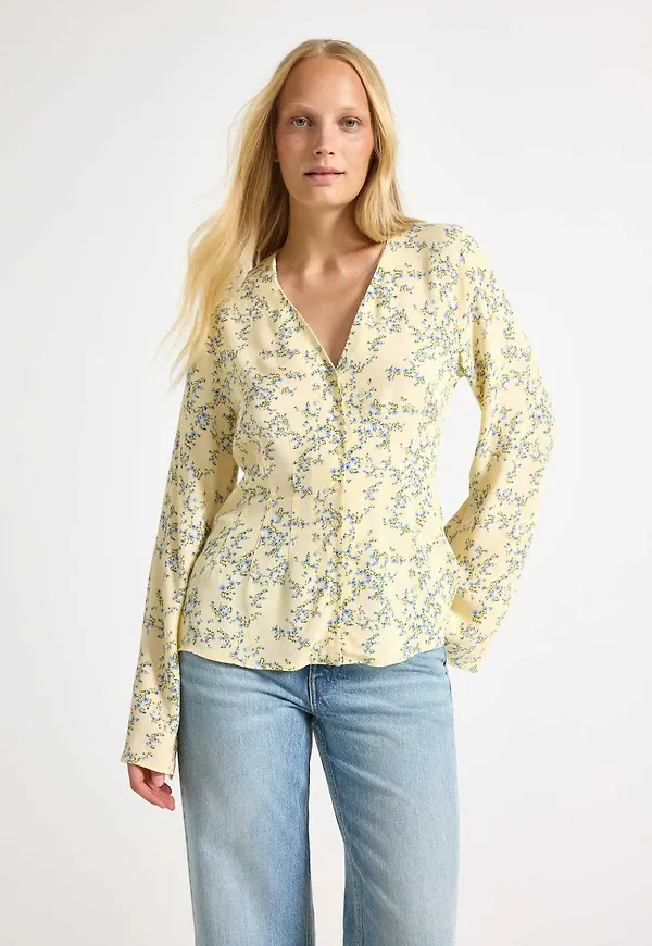 Blus med blommönster