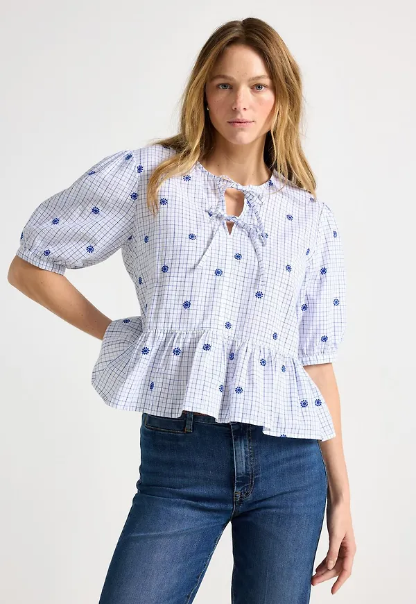 Blus med knytdetaljer