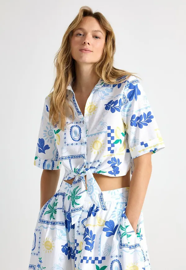 Blus med knytmidja
