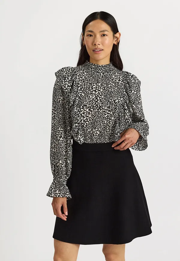 Blus med svantryck