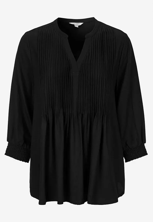 Blus med sydda veck