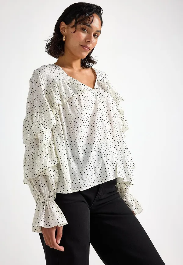 Blus med volang