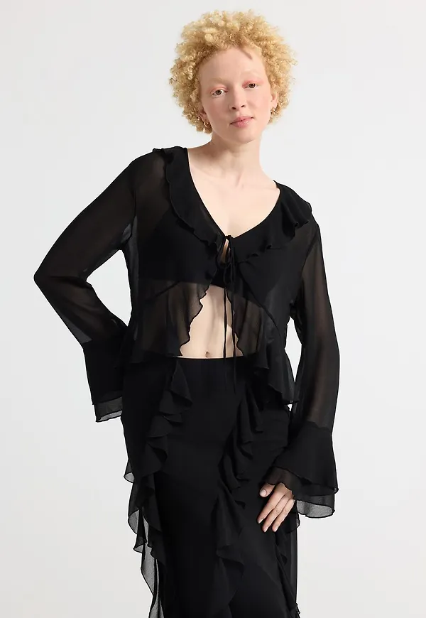 Blus med volanger