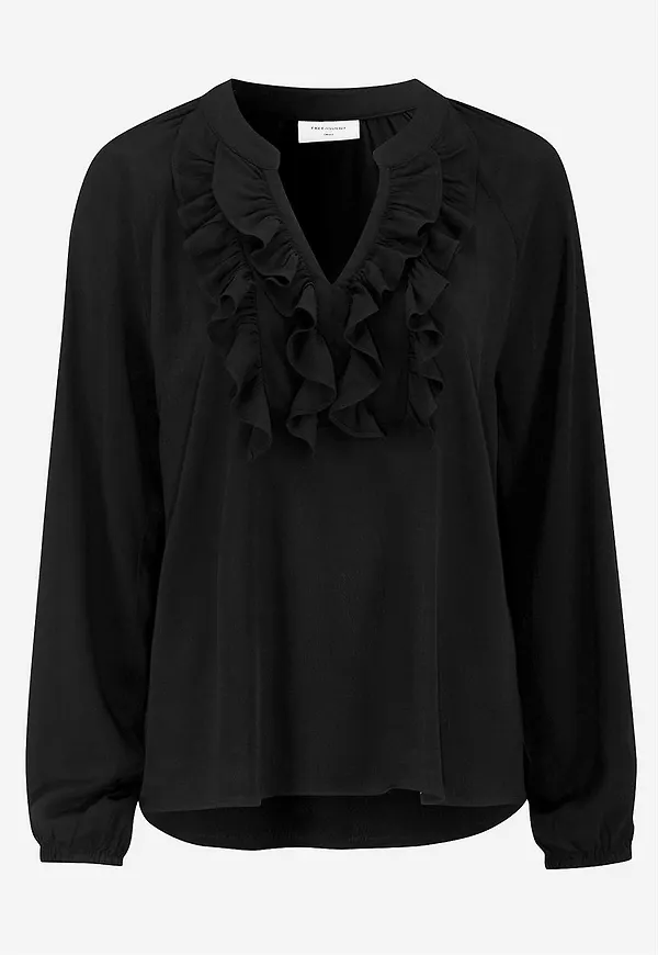 Blus med volanger