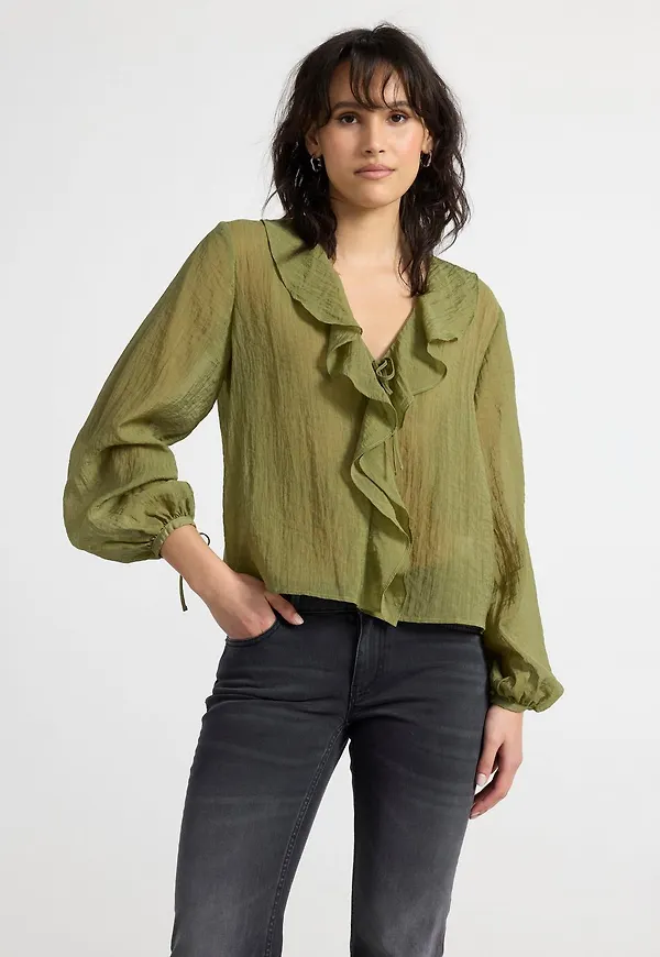Blus med volanger