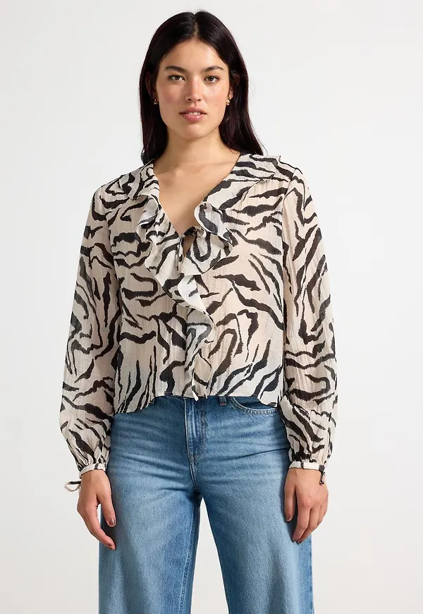 Blus med volanger
