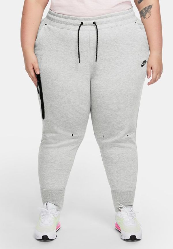 Byxor Nike Sportswear Tech Fleece för kvinnor (stora storlekar) - Grå