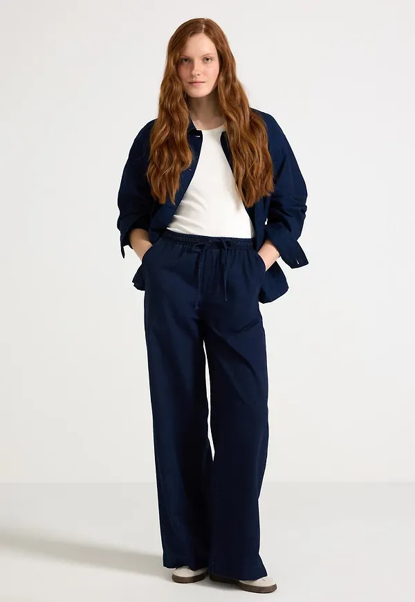 Denimbyxa med dragsko