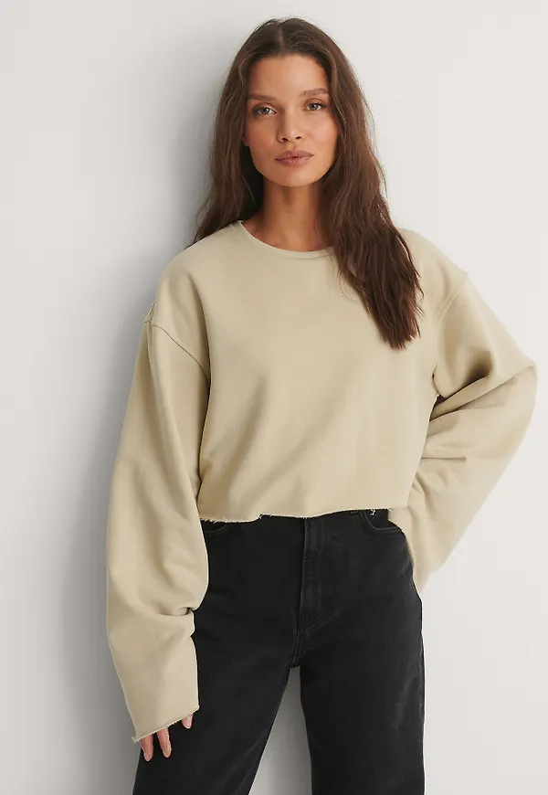 NA-KD Ekologisk Sweatshirt Med Vida Ärmar Och Rå Kant - Beige