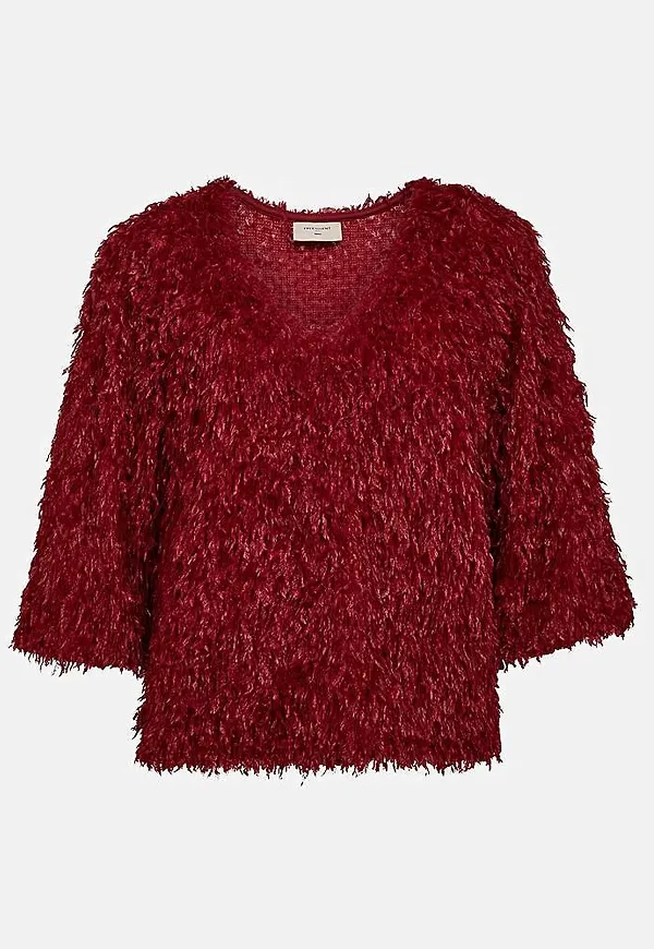 Festtopp med fjäderliknande material
