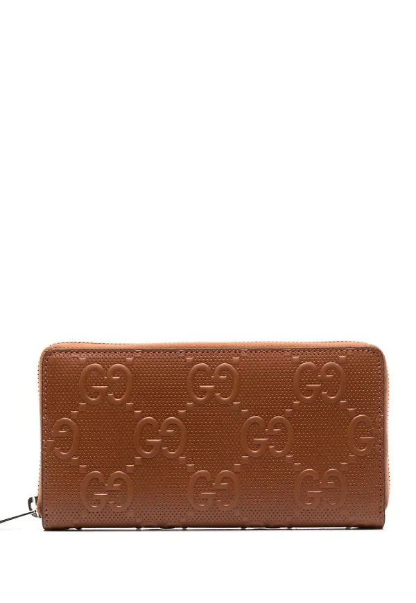 Gucci läderplånbok med präglat monogram - Brun