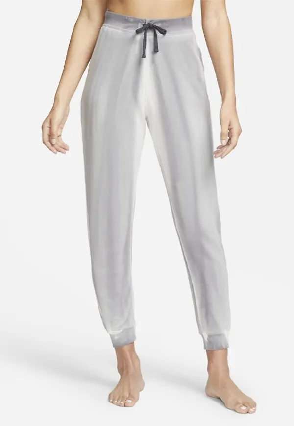 Joggingbyxor av fleece Nike Yoga Luxe i 7/8-längd för kvinnor - Grå