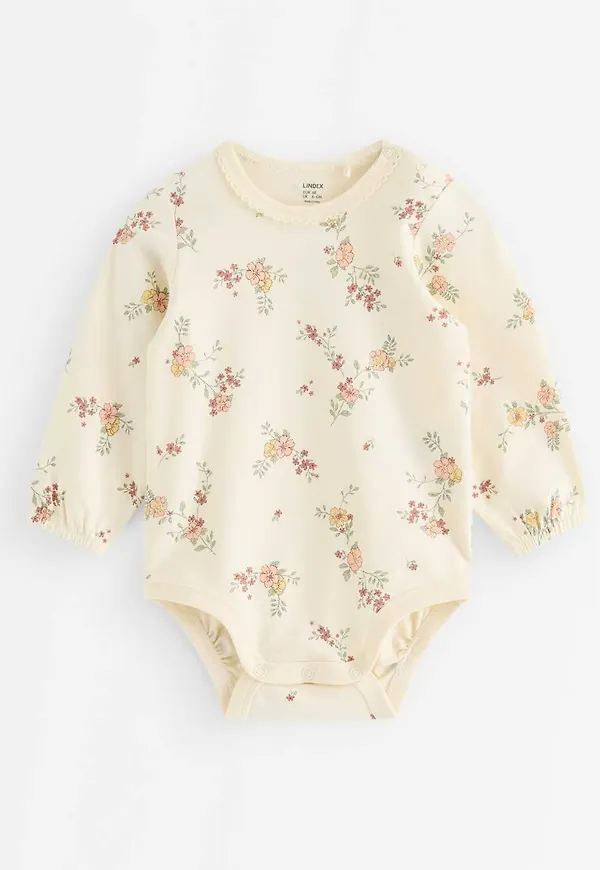 Långärmad body med blommor