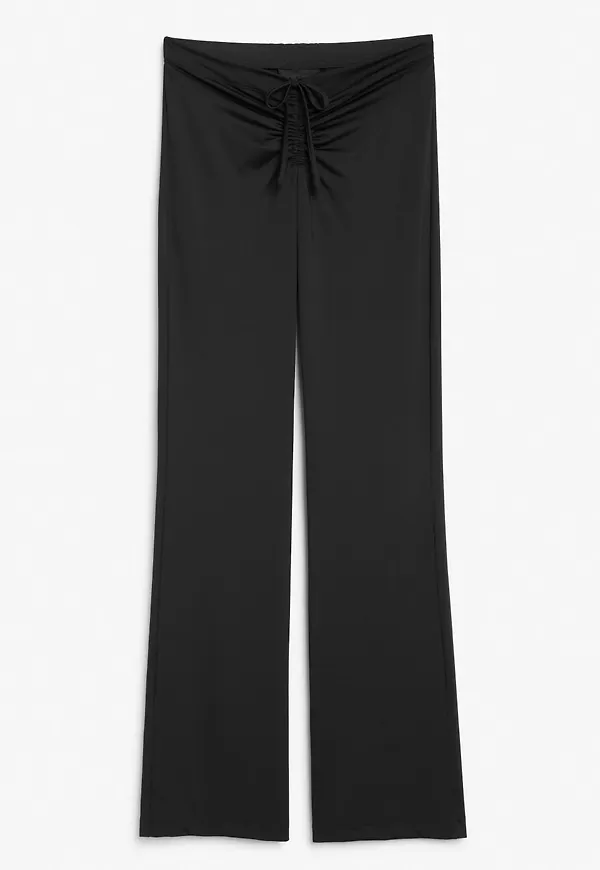 Low-waist flared trousers - Black