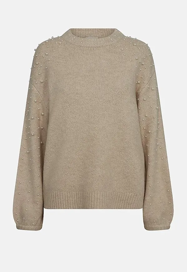 Stickad tröja med pärlor