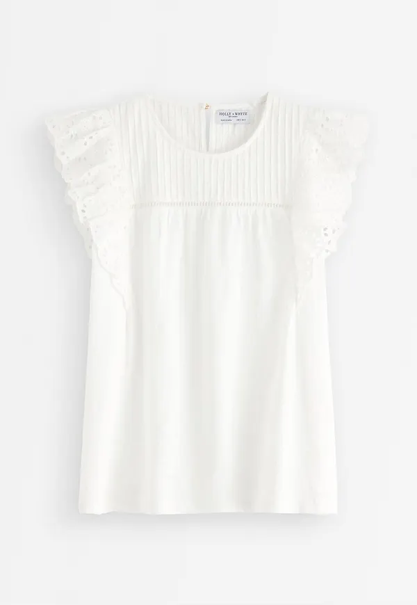 Topp med broderie anglaise