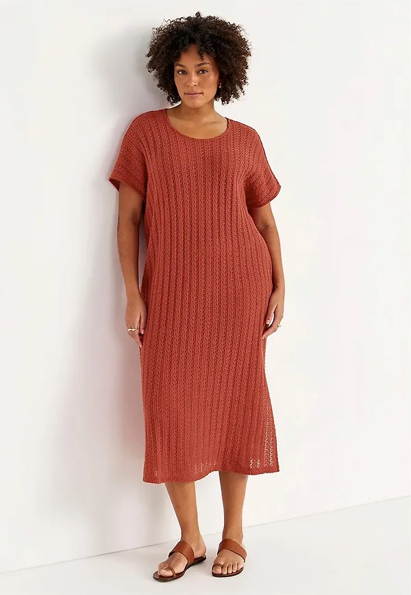Trikåklänning med hålmönster